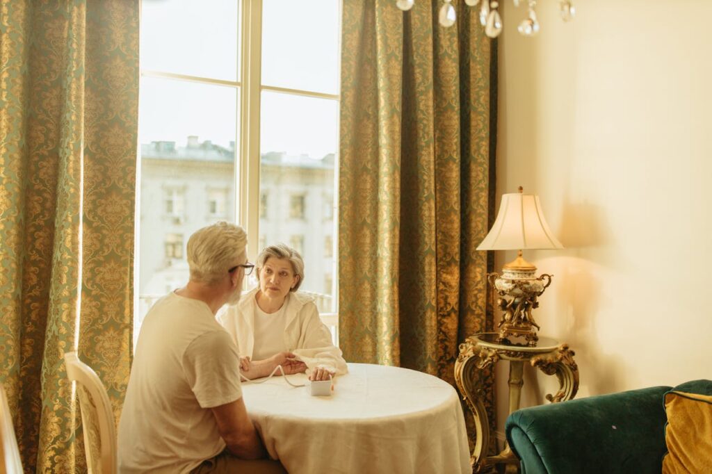 pexels photo 8088867 Senior couple uses digital monitor at home, nurturing their health in a cozy setting.